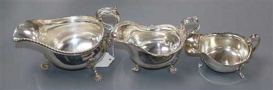 An Edwardian silver sauceboat, C.S. Harris & Sons, London, 1907 and two other silver sauceboats, 20.5 oz.